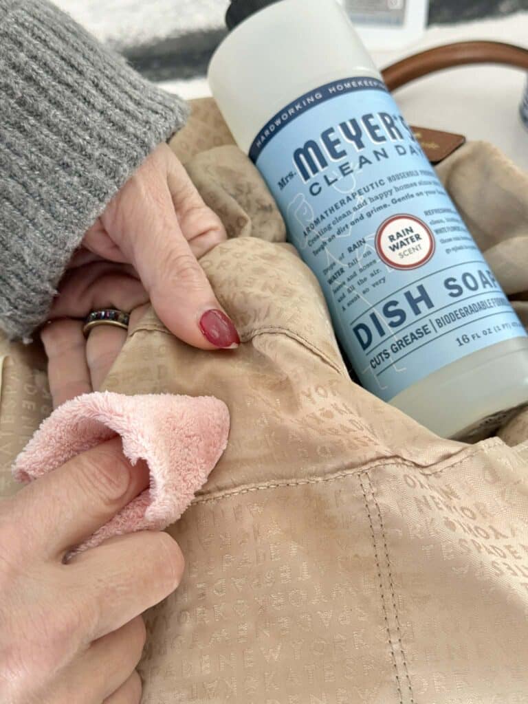 how to clean a canvas bag using a clean cloth and dish soap.