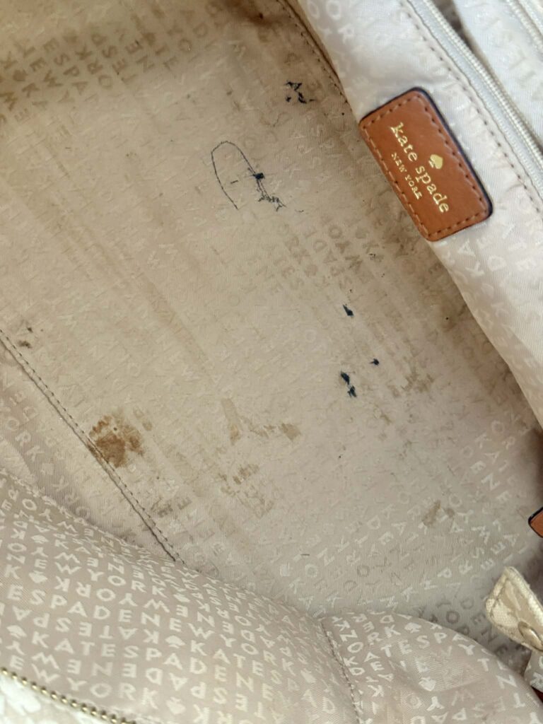 Grimy bottom of a designer handbag. How to clean a canvas bag.