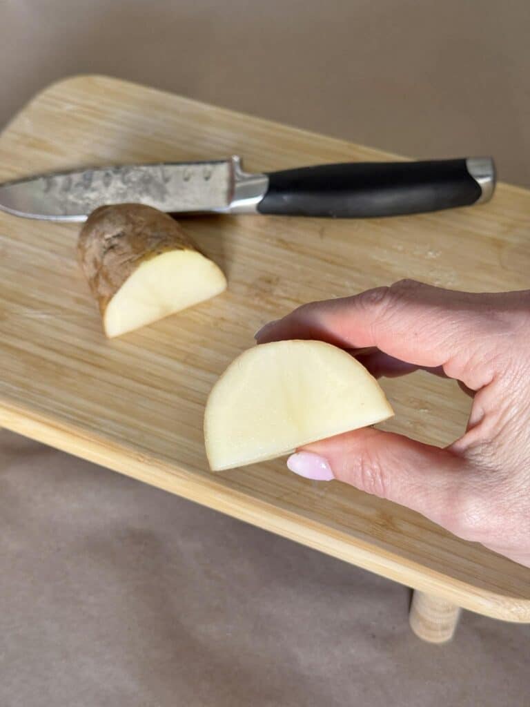 A half moon potato block for printing.