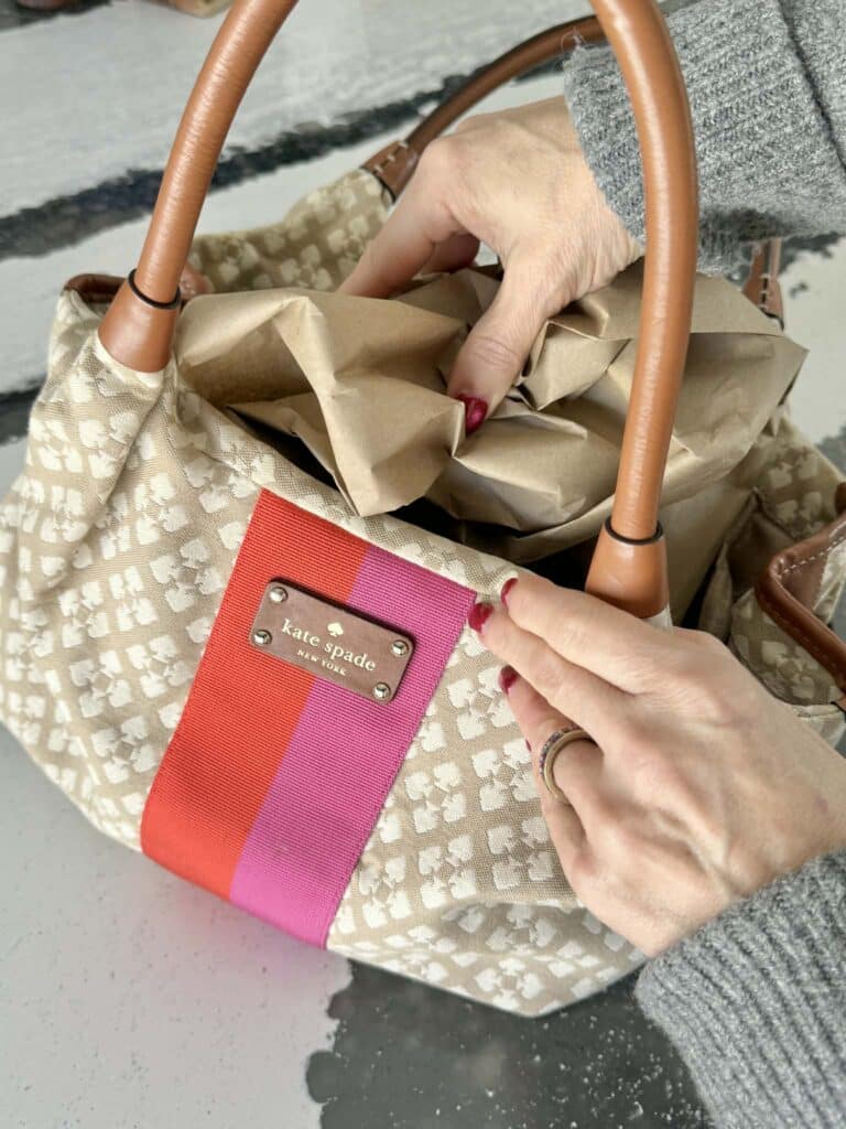 Stuffing a damp canvas bag for air drying.