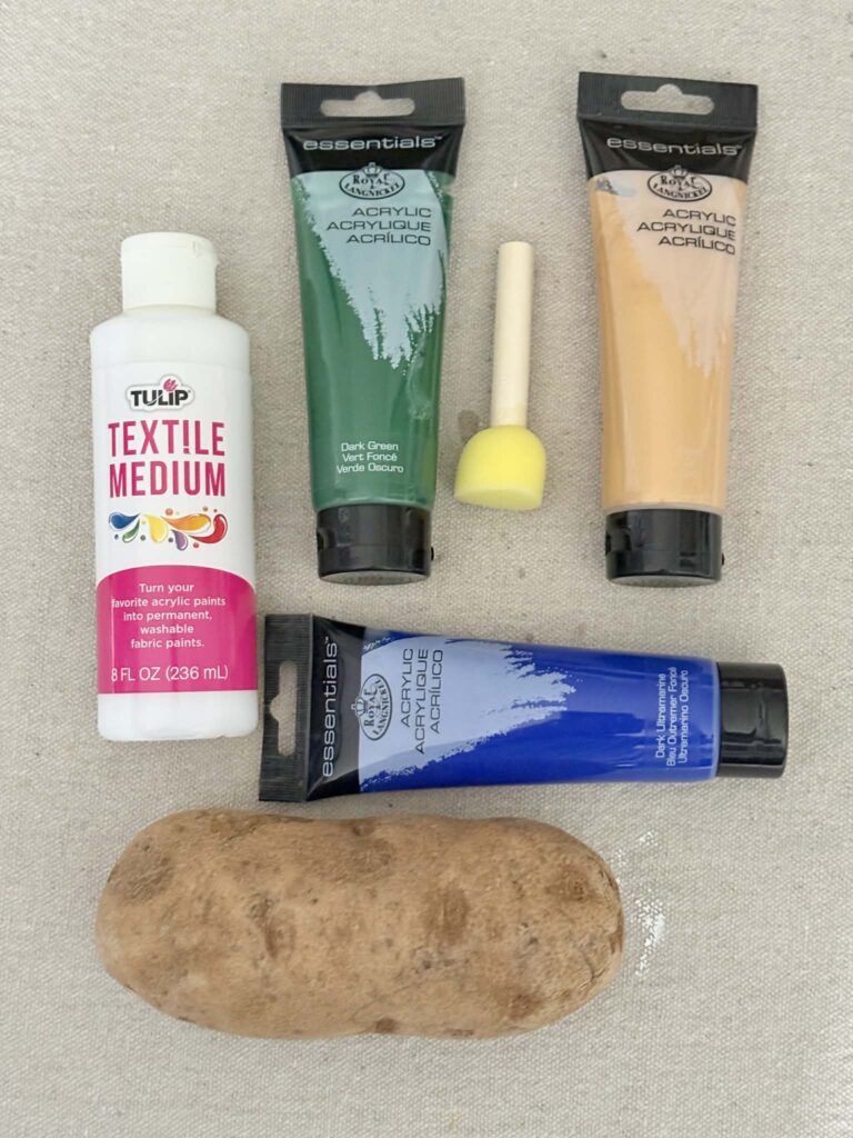 Acrylic paint, textil medium, a foam brush, and a potato.