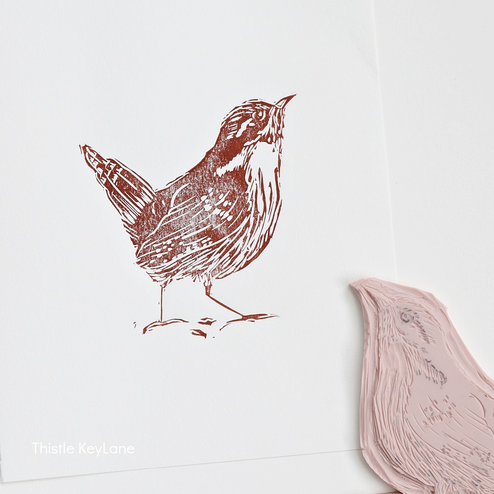 A rubber printing block and a printed image of a bird. Created by Thistle Key Lane.