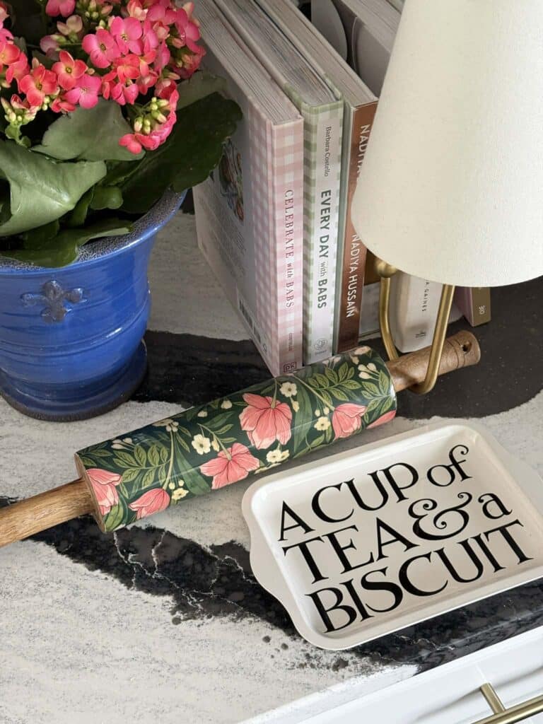 A decorative rolling pin in a William Morris pattern print.