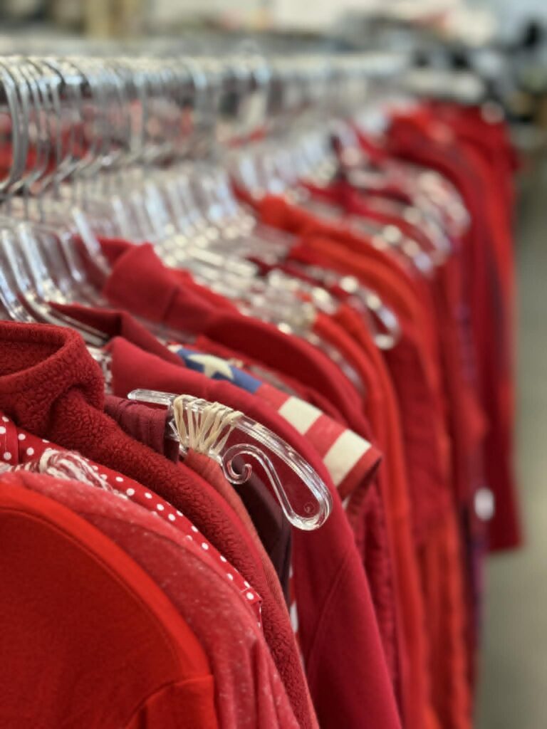 A rack of thrift store shirts.