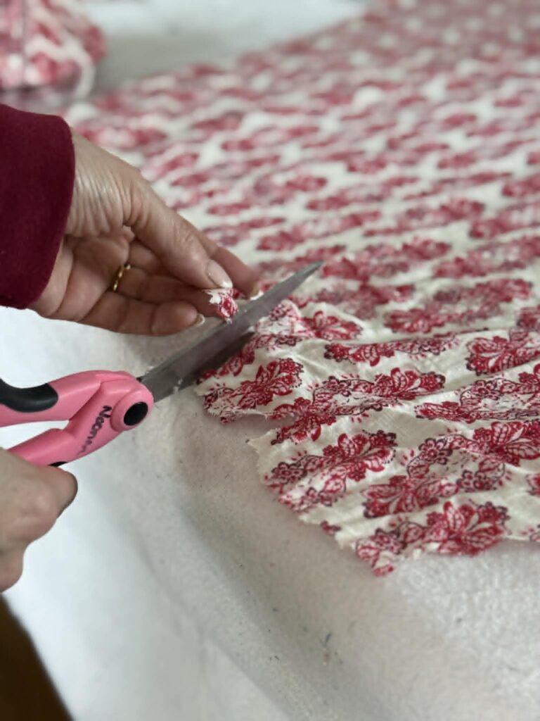 Cutting notches into fabric.
