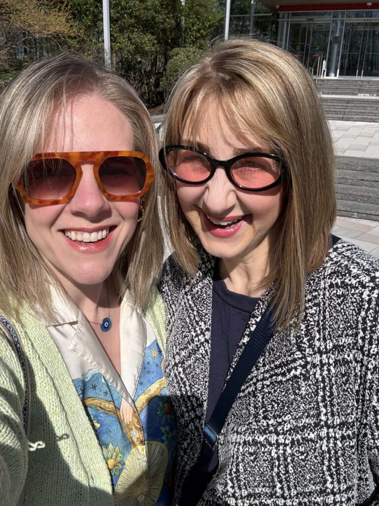 Two women wearing sunglasses.