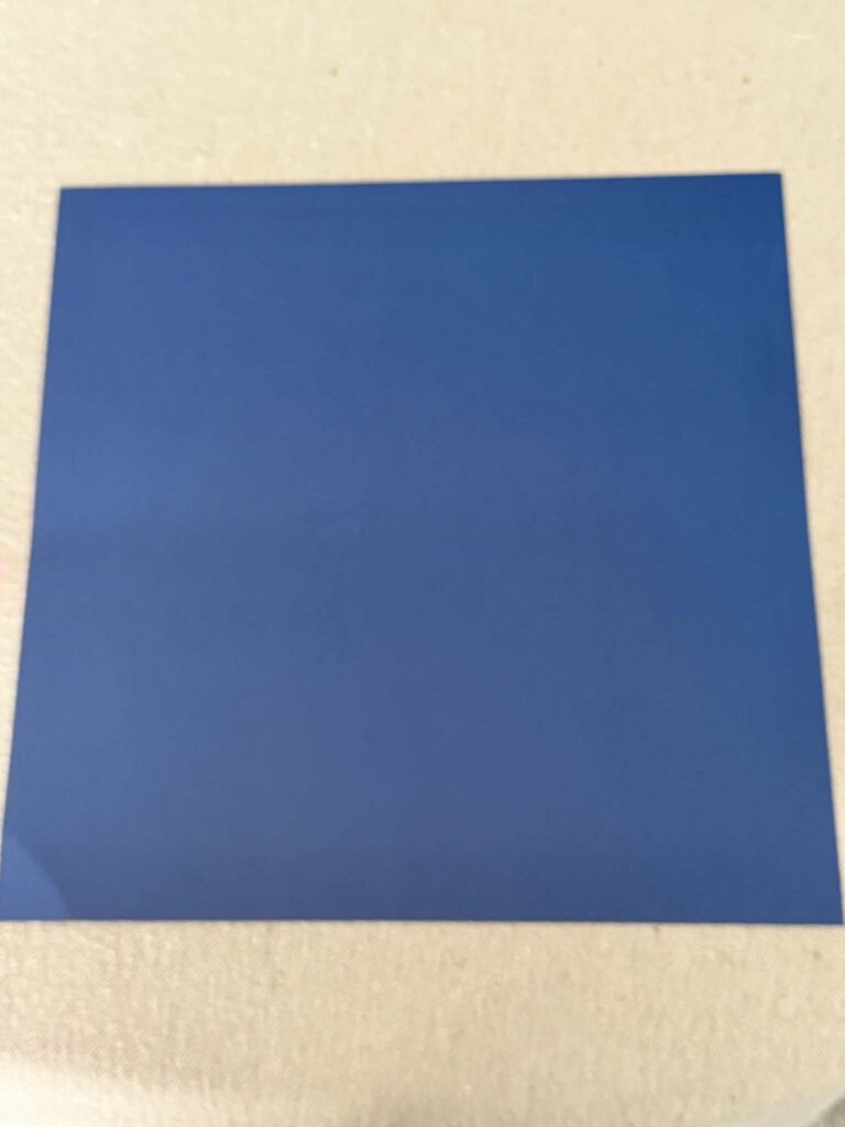 A square sheet of card stock paper.