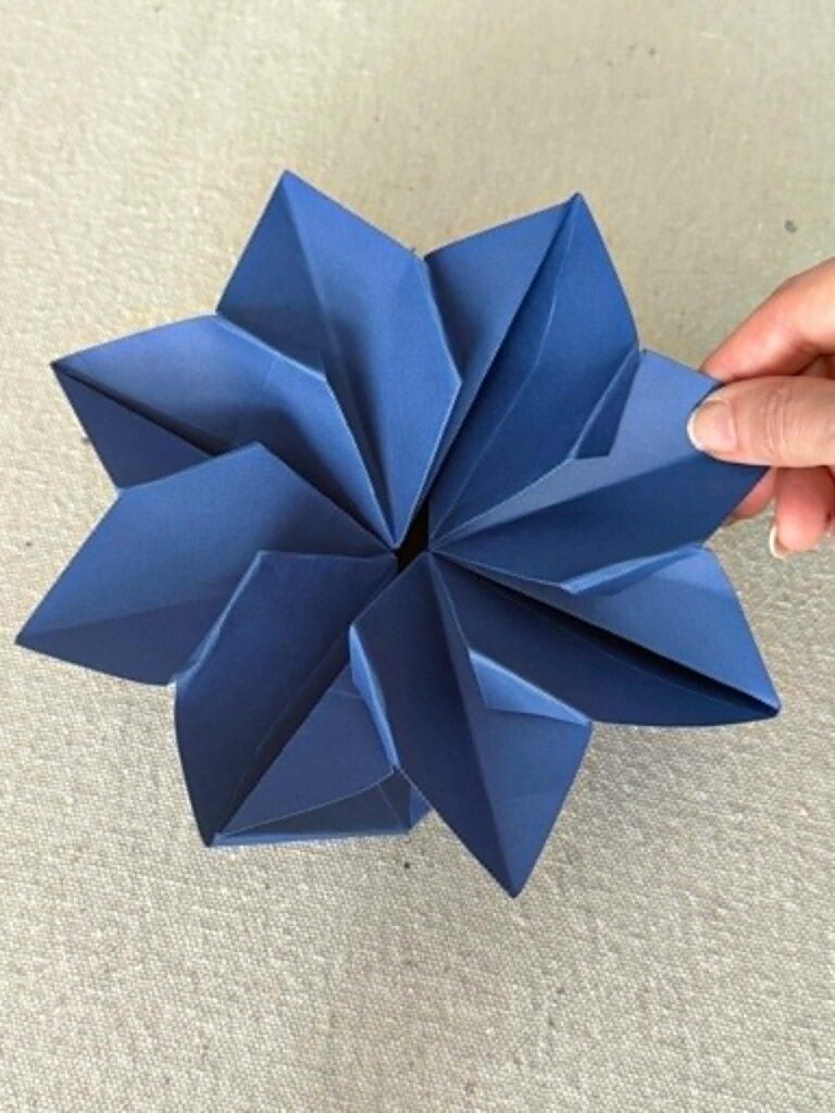 Folded tips on all the corners of an envelope created with origami.