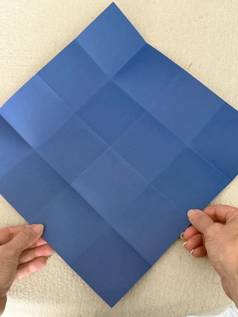Card stock paper with small square folds.