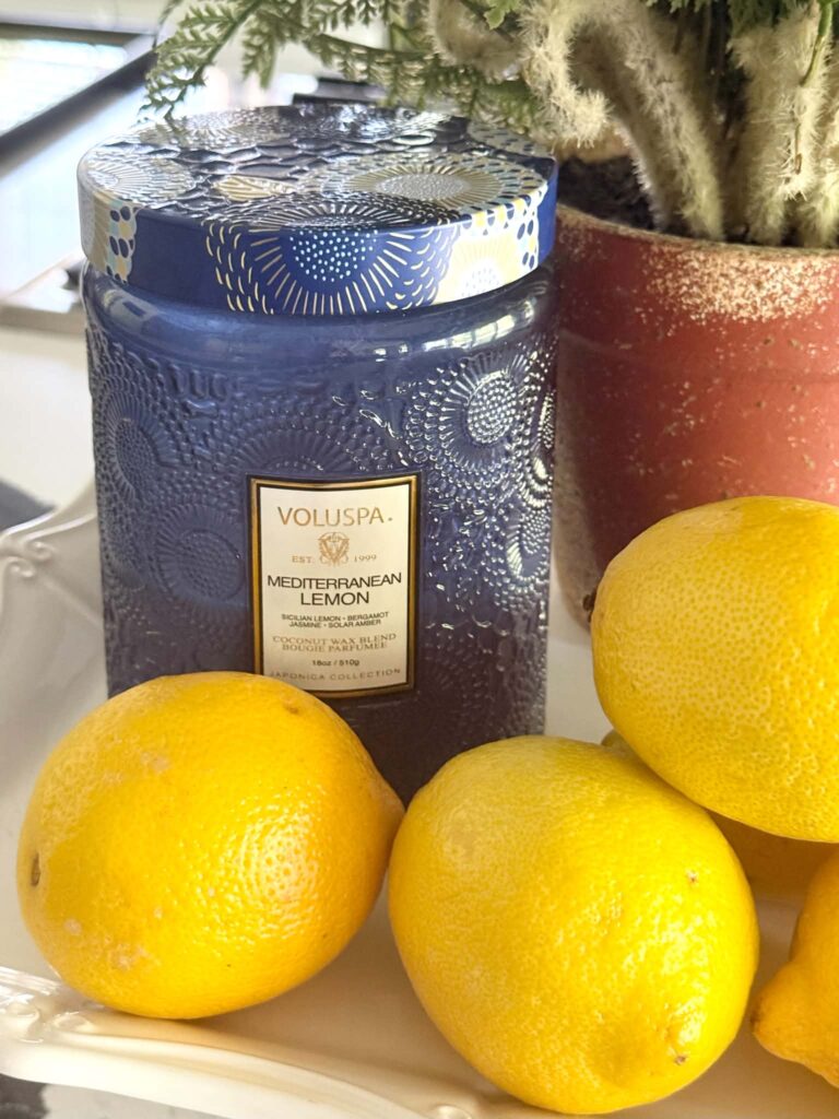 A blue jar candle in a mediterranean lemon scent.
