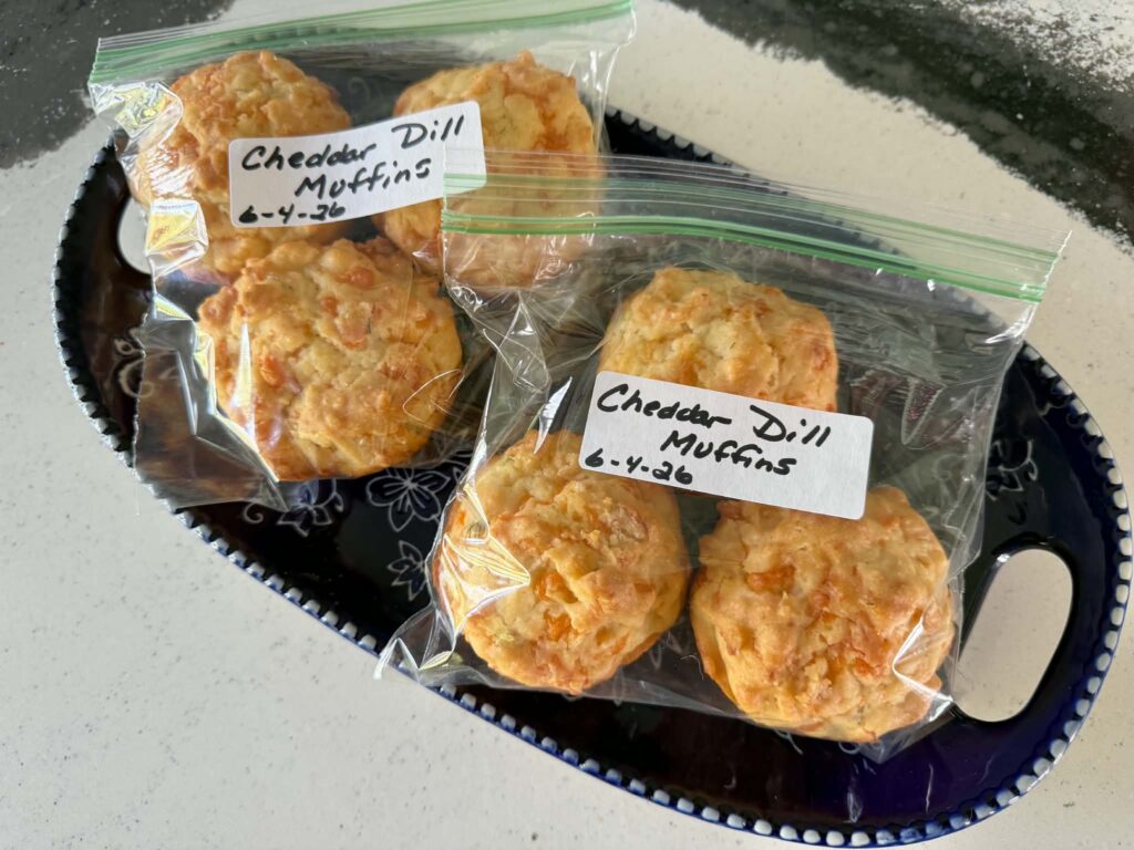 cheddar dill muffins in zip top bags and labeled with the date for the freezer.