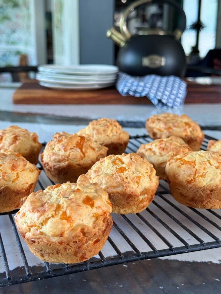 cheddar dill muffins cooling on a wire rack.
