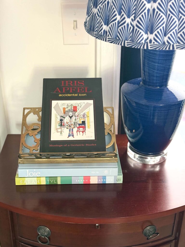 A book displayed on a brass easel.