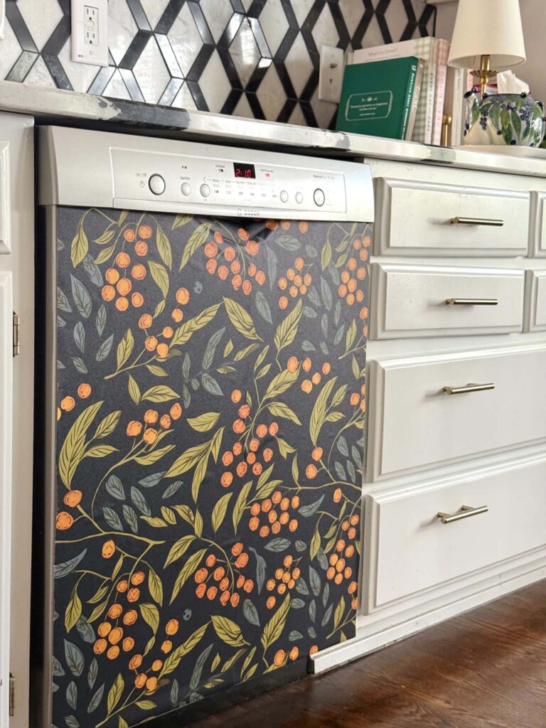 A dishwasher covered with wallpaper.