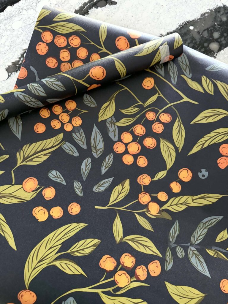 Peel-and-stick-wallpaper in a blue and orange pattern.