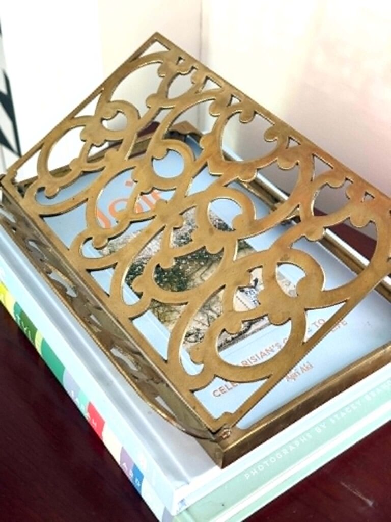 A brass book easel.