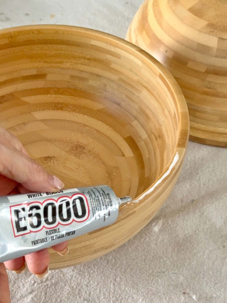 Applying E6000 glue to the rim of a wood bowl for a side table hack.