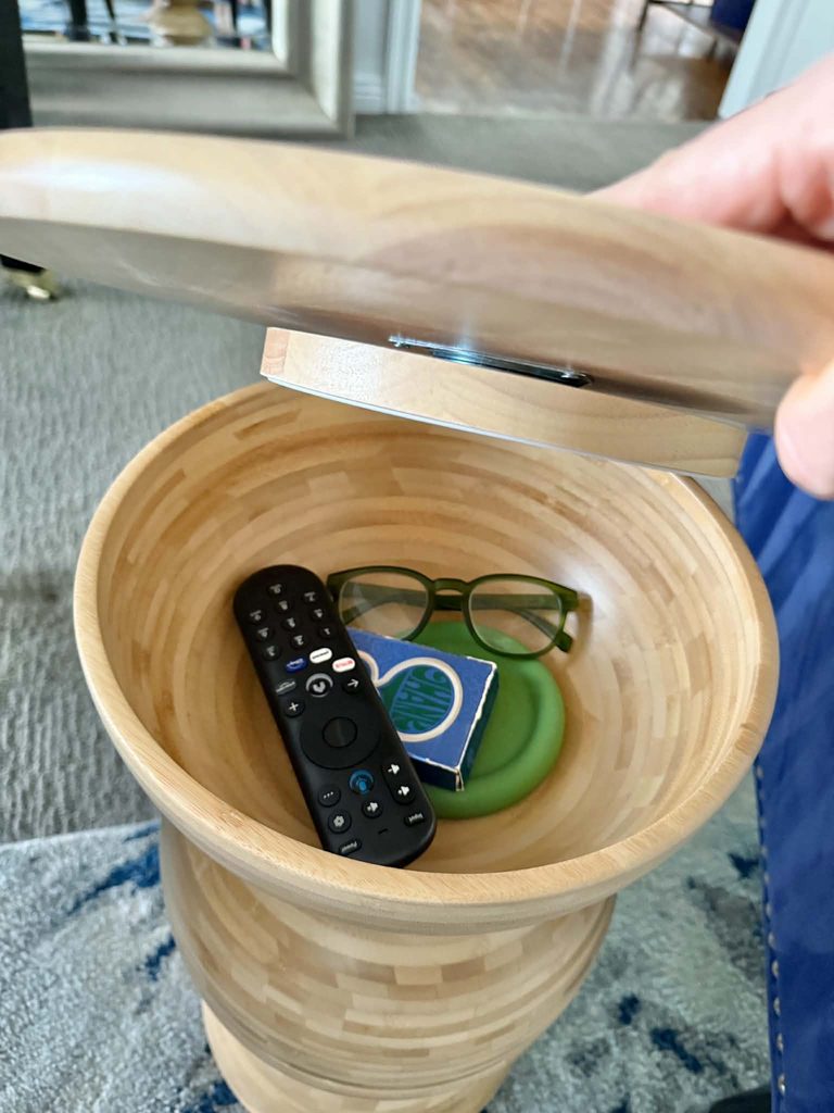 Storage in the upper tier of a DIY IKEA bowl side table.