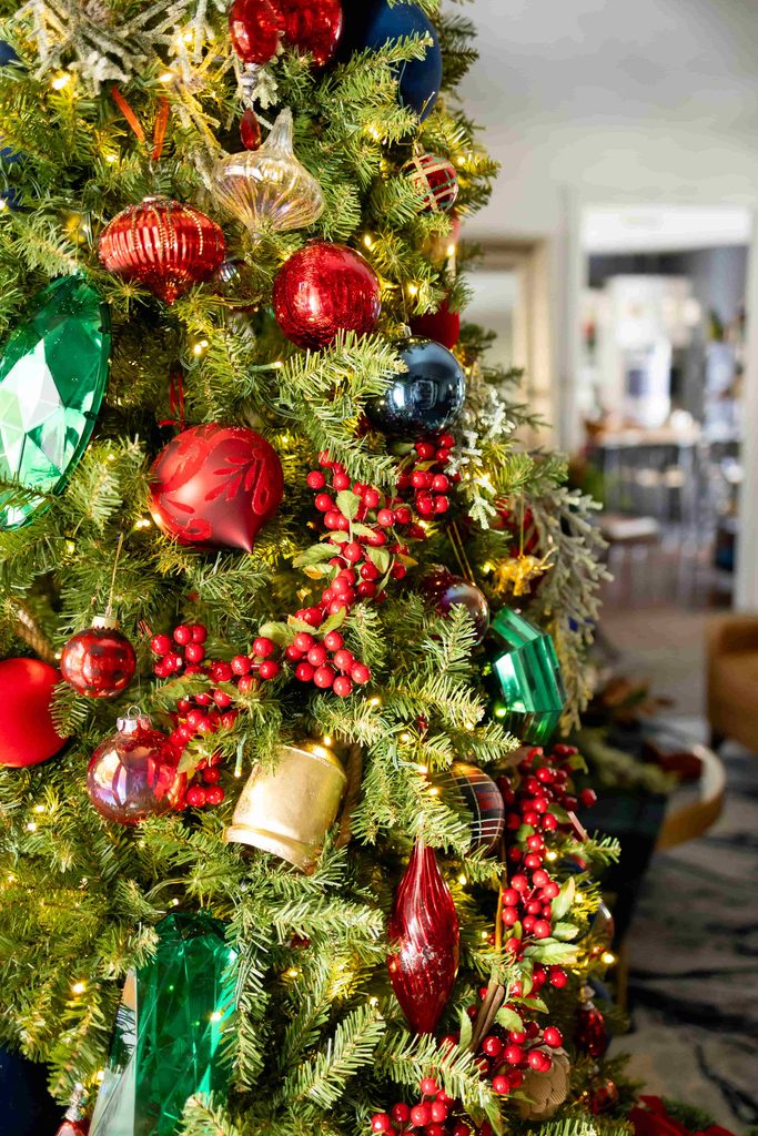 A Christmas tree decorated for a holiday party.